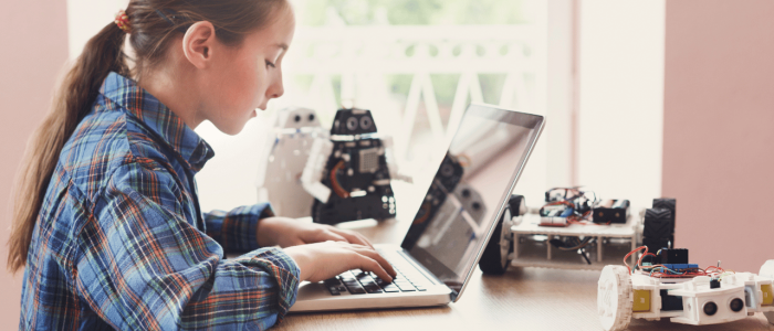 Girl working at a laptop computer