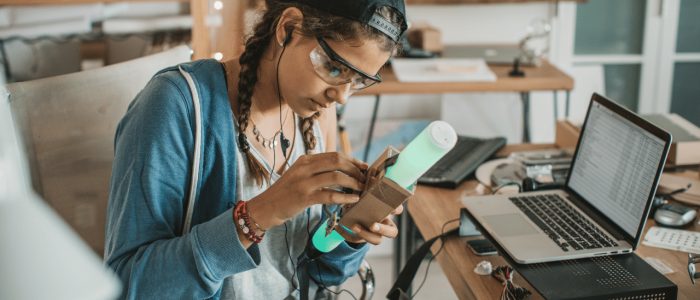 Girl working on a neon light tube