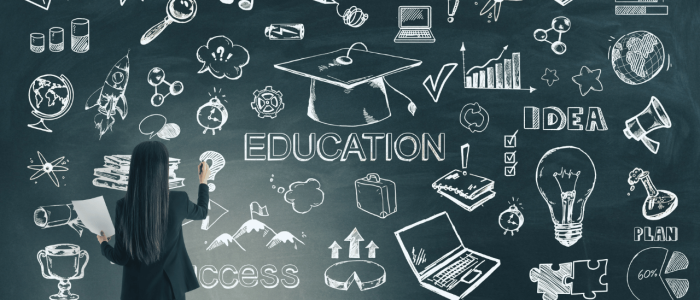 Woman in front of a blackboard with academic icons on it